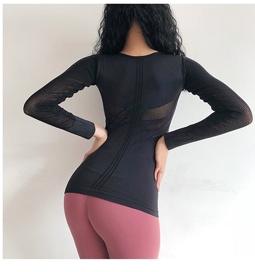 young lady
 exciting body-building playing
 t-shirt longer
 sleeves exercise tee black smooth and continuous
 moving
 shirt yoga top Gym clothes